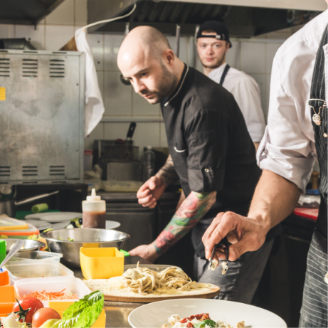 Line cooks preparing meals.
